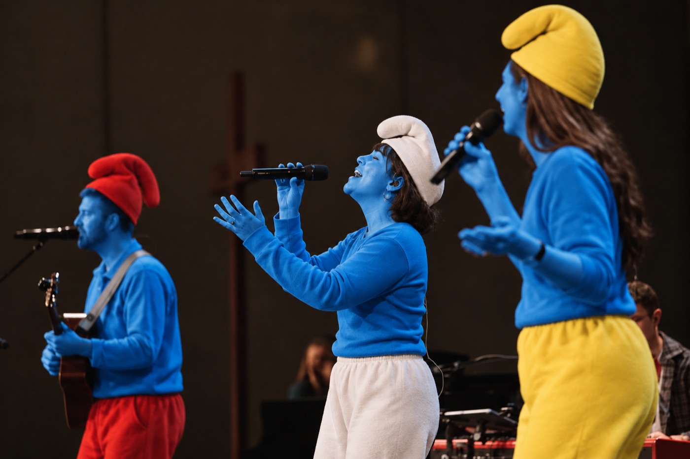 A smurf worship band leading songs